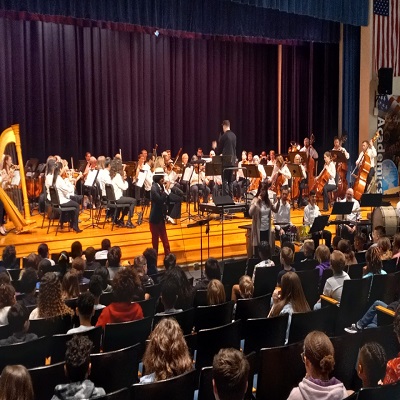 Wheeling Symphony Maestro John Devlin conducts the Wheeling Symphony while Christylez Bacon, a guest artist beatboxer, perfor